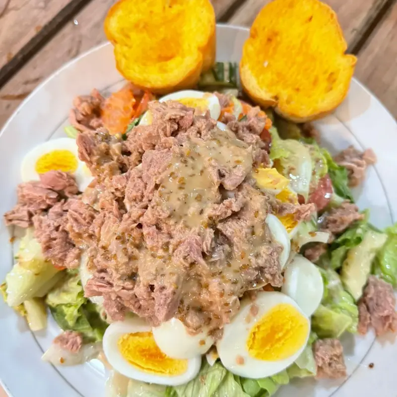 Tuna salad with boiled egg and toasted baguette