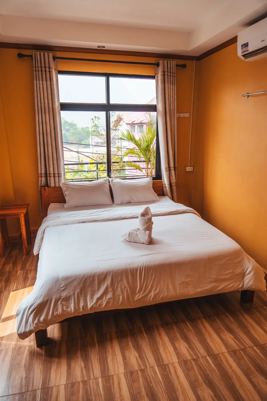 Double room with a large window and view at Vang Vieng Sunset